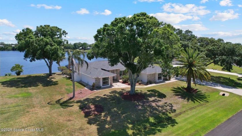 Tucked away on a spacious half-acre lot in a quiet neighborhood - Beach Home for sale in Palm Bay, Florida on Beachhouse.com