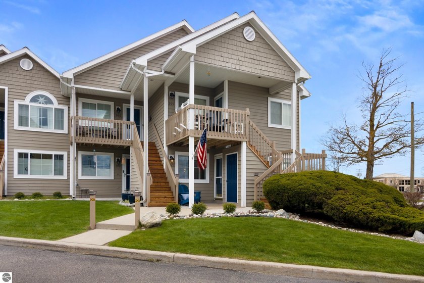 Welcome to refined Northern Michigan living along the shores of - Beach Condo for sale in Traverse City, Michigan on Beachhouse.com