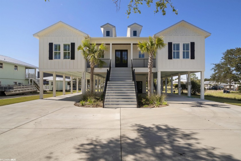 Step into your dream luxury home over looking Johnson Cove and - Beach Home for sale in Orange Beach, Alabama on Beachhouse.com