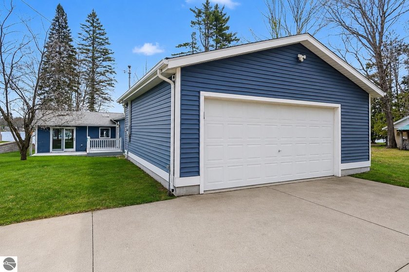 Welcome to your lakefront retreat on all-sports Cedar Lake! This - Beach Home for sale in Greenbush, Michigan on Beachhouse.com