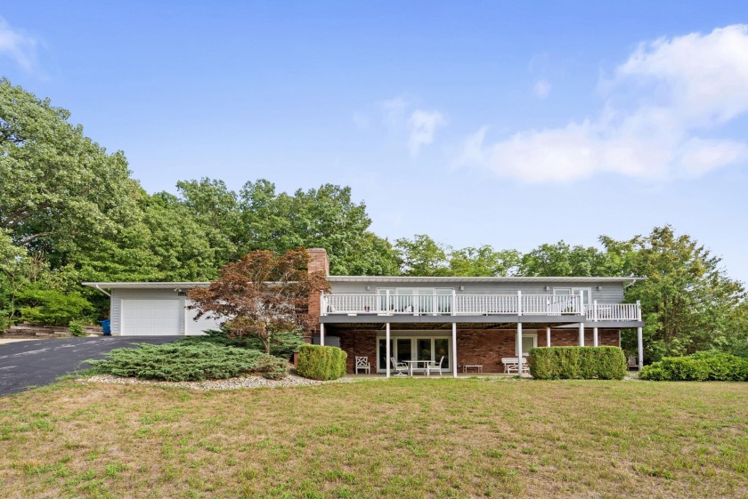 Just a short stroll to Walnut Beach, this Grand Beach getaway is - Beach Home for sale in New Buffalo, Michigan on Beachhouse.com