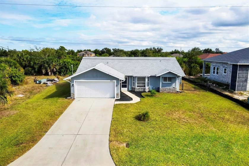 Experience elevated coastal living in this impeccably remodeled - Beach Home for sale in Port Charlotte, Florida on Beachhouse.com