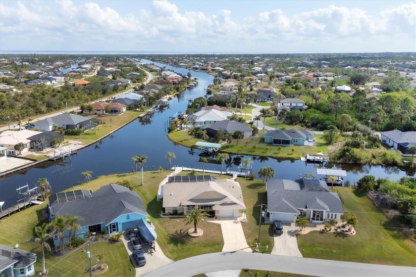 This charming waterfront residence sits on a 16,820-square-foot - Beach Home for sale in Port Charlotte, Florida on Beachhouse.com
