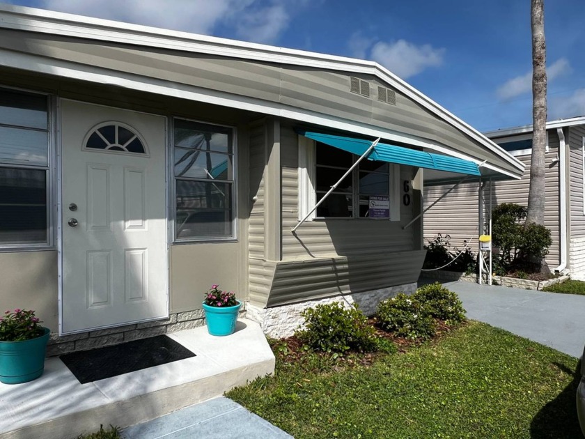 JUST REDUCED! Charming, partially furnished, two-bedroom - Beach Home for sale in Dunedin, Florida on Beachhouse.com