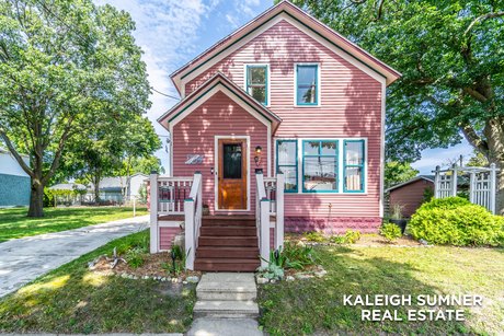 Step into The Pink Mitten, a historic home built in 1900 that - Beach Home for sale in Manistee, Michigan on Beachhouse.com