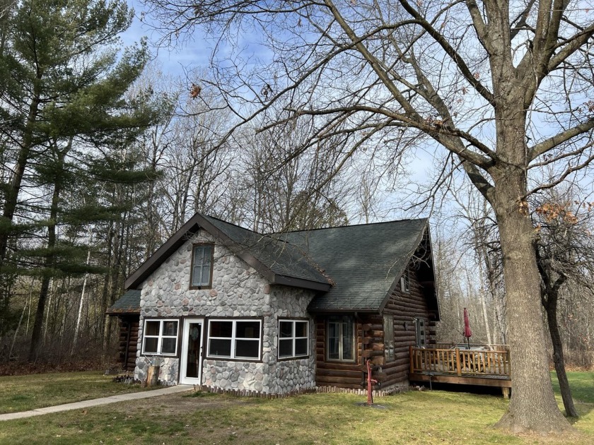 This immaculate 3-bedroom Amish built log home is situated on - Beach Home for sale in Free Soil, Michigan on Beachhouse.com