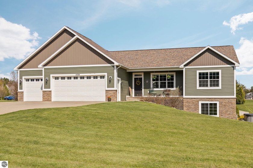 Tucked into one of Long Lake Township's most desirable - Beach Home for sale in Traverse City, Michigan on Beachhouse.com
