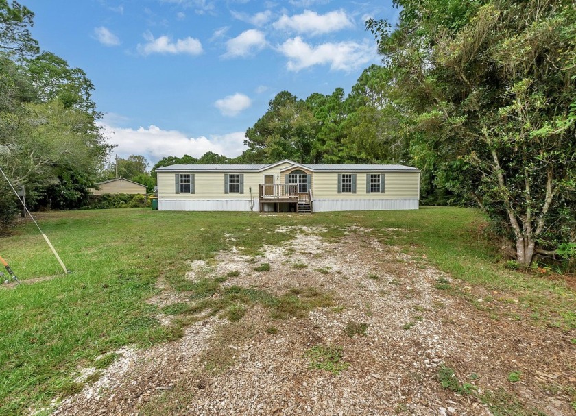 Experience coastal paradise in this 4-bed, 3-bath lake view home - Beach Home for sale in Mary Esther, Florida on Beachhouse.com