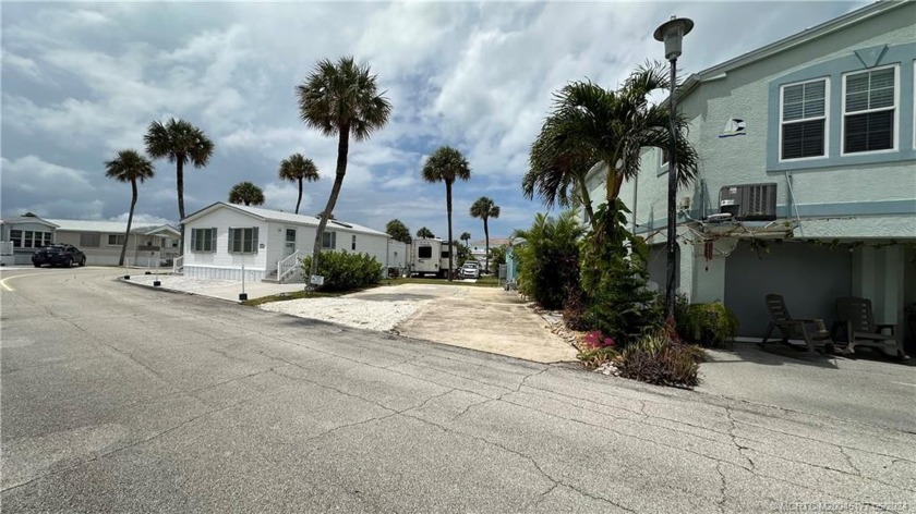 VERY RARE FRONT PORCH VIEW OF A 1+ ACRE LANDSCAPED GRASSY LOT - Beach Lot for sale in Jensen Beach, Florida on Beachhouse.com