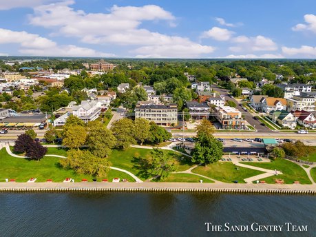 Experience the pinnacle of Grand Haven living with this - Beach Condo for sale in Grand Haven, Michigan on Beachhouse.com