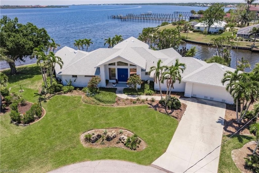 Nestled on a stunning tip lot with breathtaking views of the - Beach Home for sale in Port Charlotte, Florida on Beachhouse.com