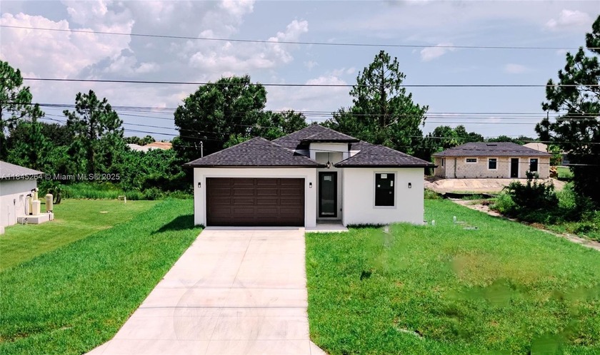 Don't miss this brand-new construction home located just minutes - Beach Home for sale in Lehigh Acres, Florida on Beachhouse.com