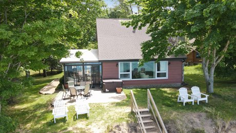 Enjoy the ever-changing Lake Michigan views from this four - Beach Home for sale in Manistee, Michigan on Beachhouse.com