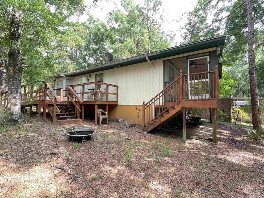 Welcome to this lakefront home tucked back away from the hustle - Beach Home for sale in Milton, Florida on Beachhouse.com