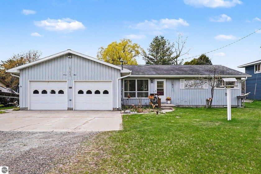 Thoughtfully updated home with easy main-floor living, this - Beach Home for sale in Tawas City, Michigan on Beachhouse.com