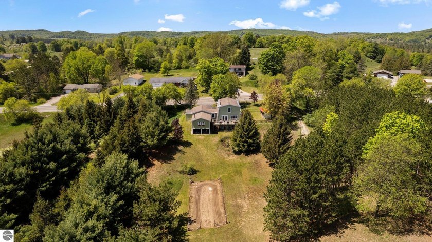 Enjoy views of Lake Leelanau from this charming and updated 3 - Beach Home for sale in Cedar, Michigan on Beachhouse.com
