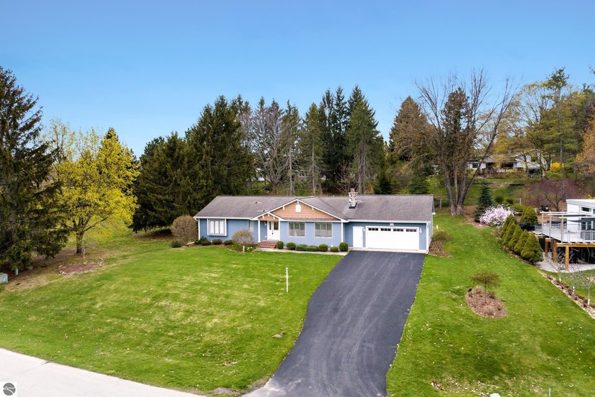 Enjoy the best of Northern Michigan living in this beautifully - Beach Home for sale in Traverse City, Michigan on Beachhouse.com