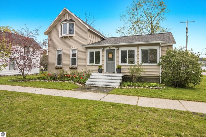 Charming Village of Elk Rapids Home on a Large Corner Lot! This - Beach Home for sale in Elk Rapids, Michigan on Beachhouse.com