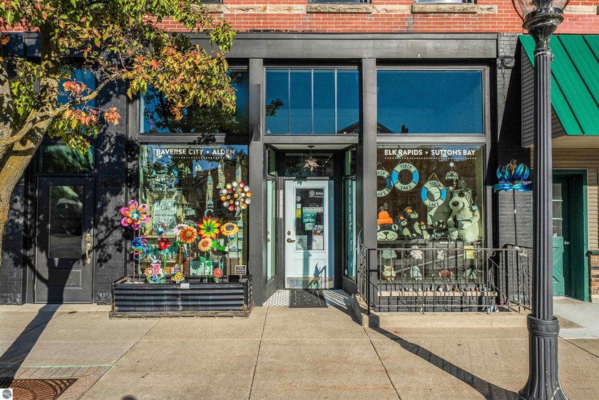 Located in the heart of downtown Elk Rapids, this rare mixed-use - Beach Commercial for sale in Elk Rapids, Michigan on Beachhouse.com