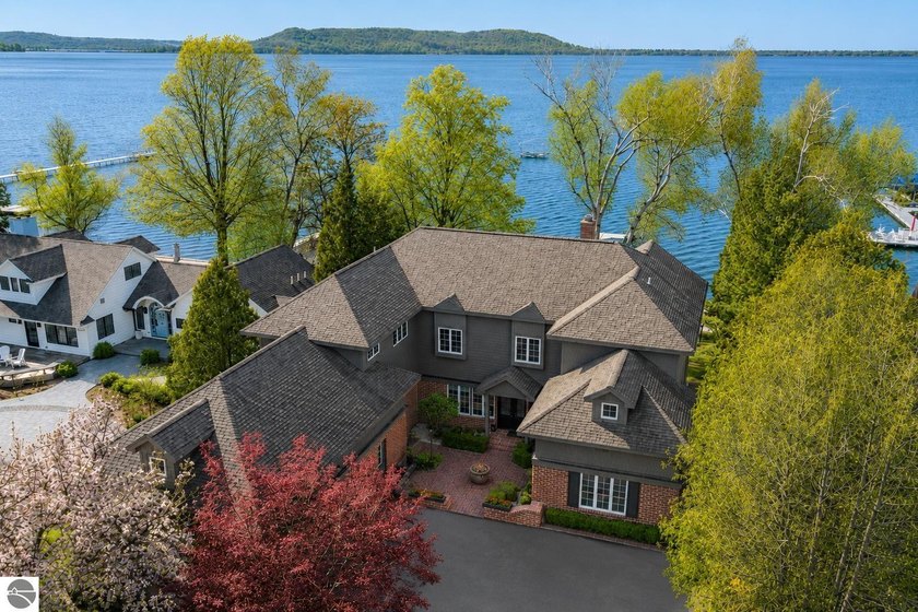 Set on the coveted south end of Big Glen Lake with 90 feet of - Beach Home for sale in Glen Arbor, Michigan on Beachhouse.com