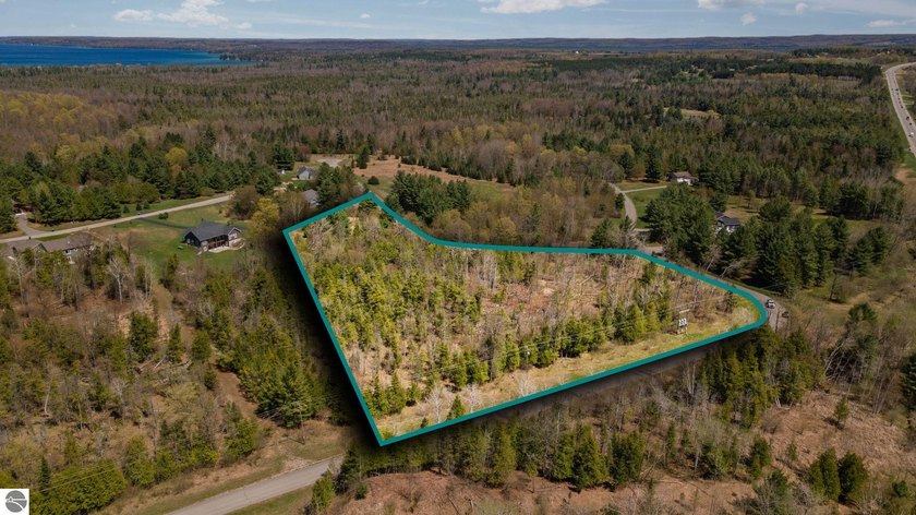 Build your dream home on this stunning wooded parcel in - Beach Acreage for sale in Williamsburg, Michigan on Beachhouse.com