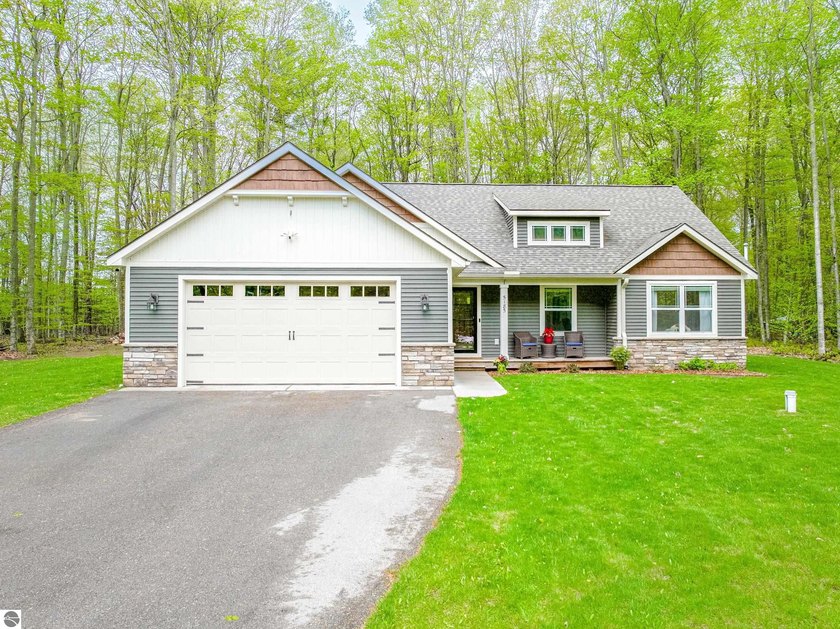 Lovely west side home offering desirable main floor living and - Beach Home for sale in Traverse City, Michigan on Beachhouse.com