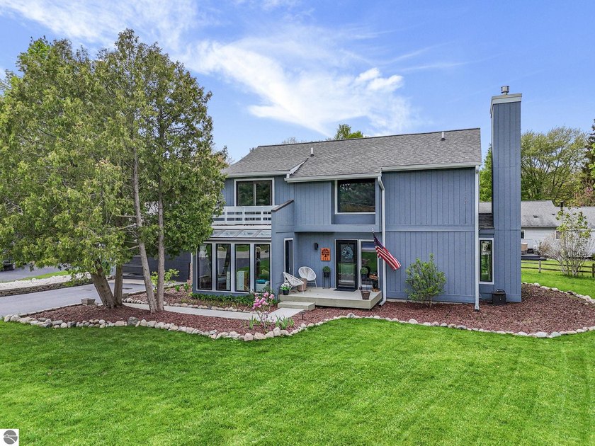 Perfectly positioned at the base of coveted Old Mission - Beach Home for sale in Traverse City, Michigan on Beachhouse.com