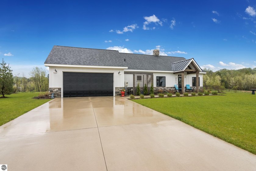 Designed for easy living and effortless enjoyment, this - Beach Home for sale in Maple City, Michigan on Beachhouse.com