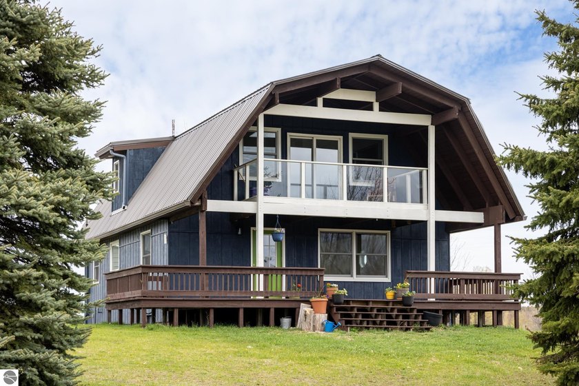 Perched atop a scenic hill along the iconic Leelanau TART Trail - Beach Home for sale in Traverse City, Michigan on Beachhouse.com