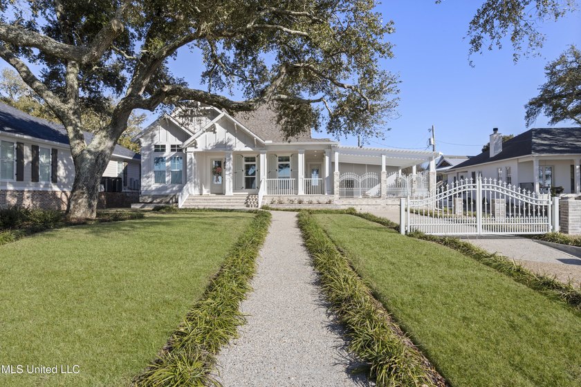 Stunning beachfront bungalow located on a prime corner lot with - Beach Home for sale in Gulfport, Mississippi on Beachhouse.com
