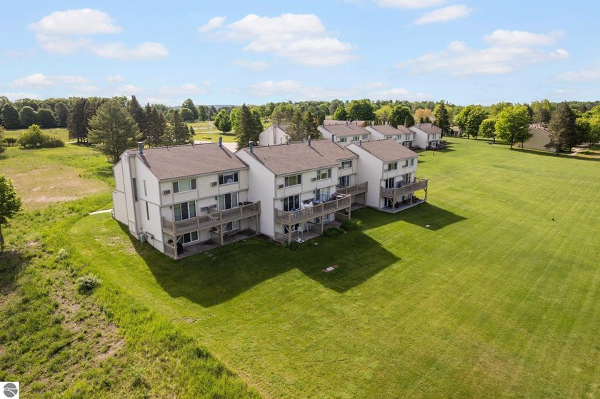 Impeccably kept, this charming 4 bed/4 bath Sugar Loaf townhouse - Beach Condo for sale in Cedar, Michigan on Beachhouse.com