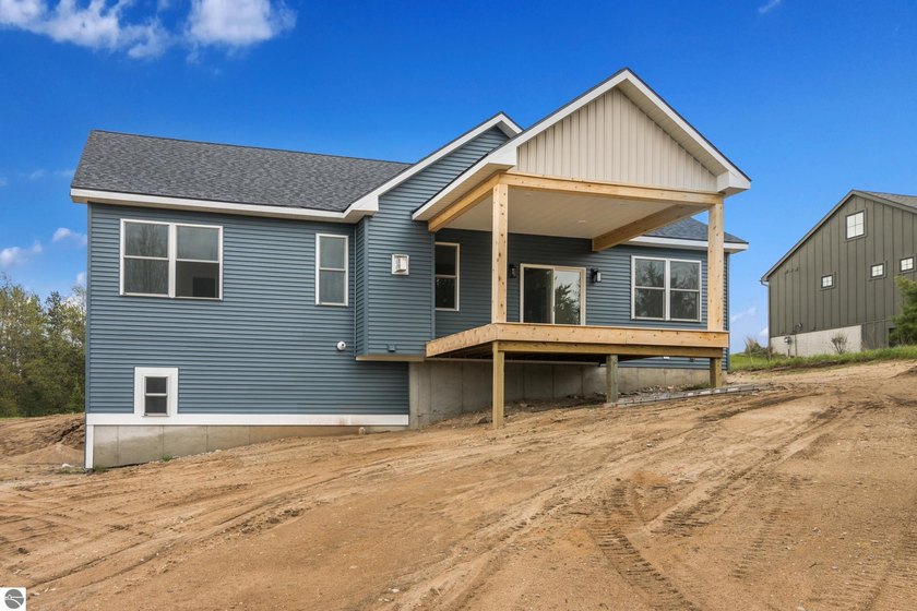 Thoughtfully designed and full of charm, this new construction - Beach Home for sale in Maple City, Michigan on Beachhouse.com