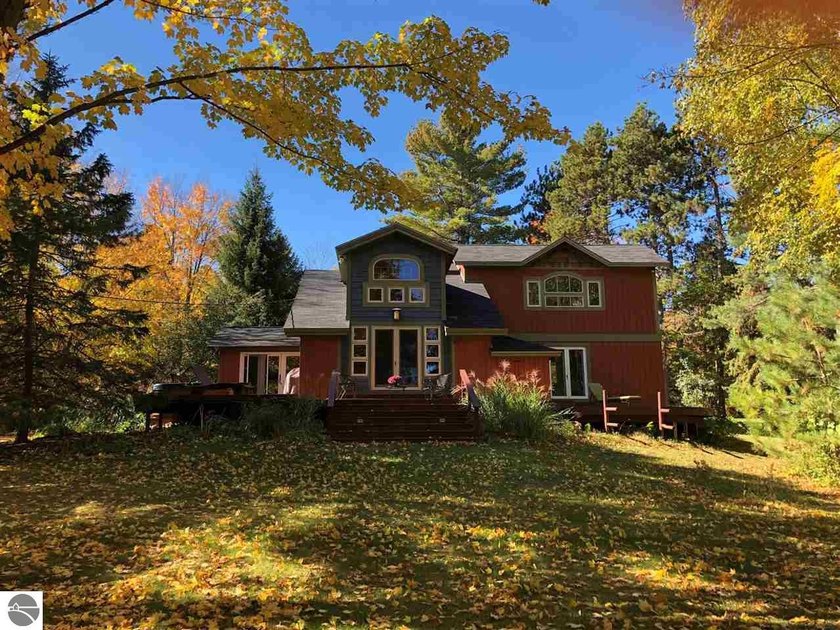Come home to over half an acre surrounded by land that gives - Beach Home for sale in Kewadin, Michigan on Beachhouse.com