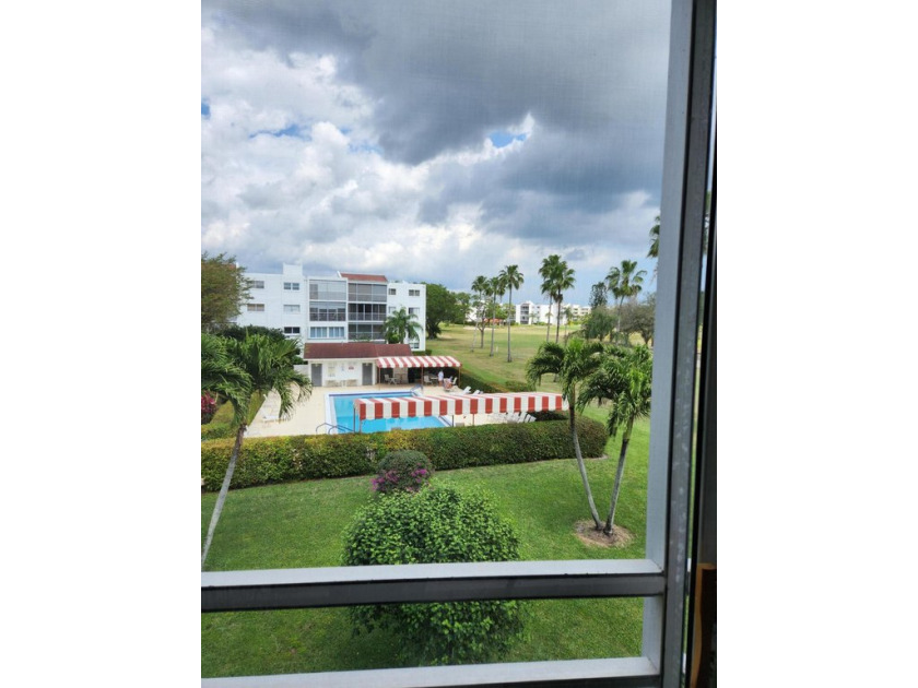 Enjoy the view of the beautiful Poinciana Golf Course and pool - Beach Condo for sale in Lake Worth, Florida on Beachhouse.com