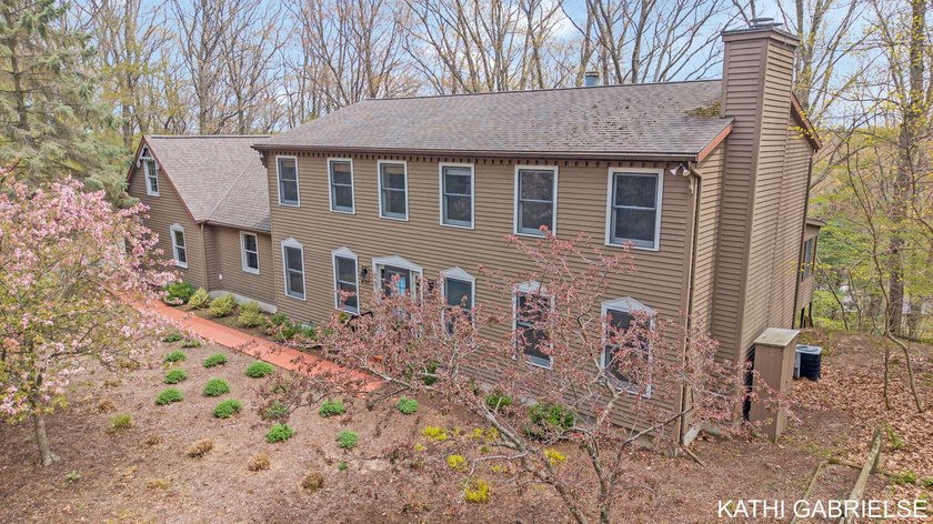 Tucked away on a private road just steps from the shores of Lake - Beach Home for sale in Grand Haven, Michigan on Beachhouse.com