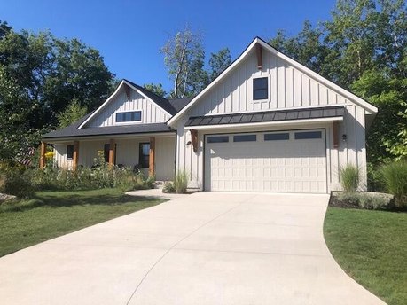 Savor chats on the private front or back porch as you await the - Beach Home for sale in Douglas, Michigan on Beachhouse.com