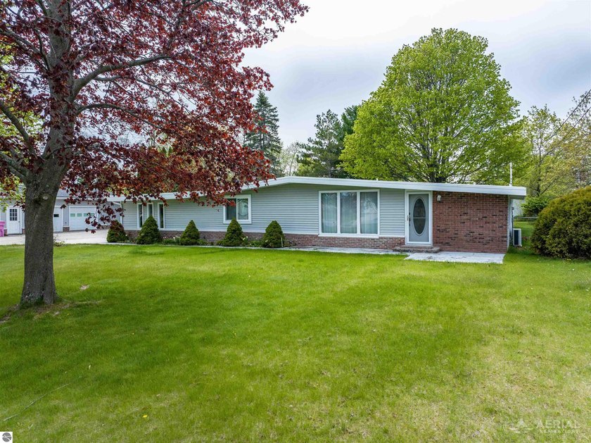 This rambling ranch blends classic mid-century character with - Beach Home for sale in Oscoda, Michigan on Beachhouse.com