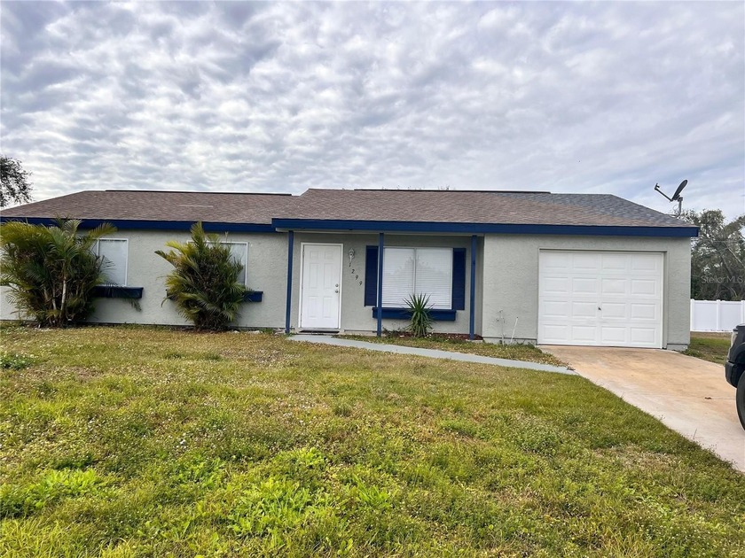 Available Now!  Featuring three bedrooms, two bathrooms, and a - Beach Home for sale in Port Charlotte, Florida on Beachhouse.com