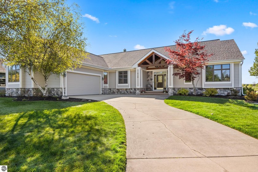 Positioned directly on the 11th fairway of The Bear Golf Course - Beach Home for sale in Williamsburg, Michigan on Beachhouse.com
