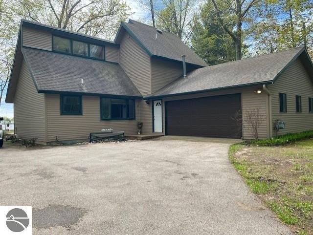 Beautiful park like setting on Bass Lake just outside of Elk - Beach Home for sale in Elk Rapids, Michigan on Beachhouse.com