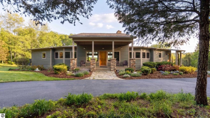 Tucked away on just over 10 acres of beautifully rolling terrain - Beach Home for sale in Maple City, Michigan on Beachhouse.com