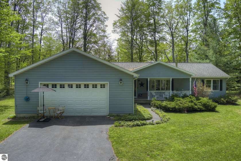 Discover the outdoor lifestyle you've been dreaming of in this - Beach Home for sale in Cedar, Michigan on Beachhouse.com
