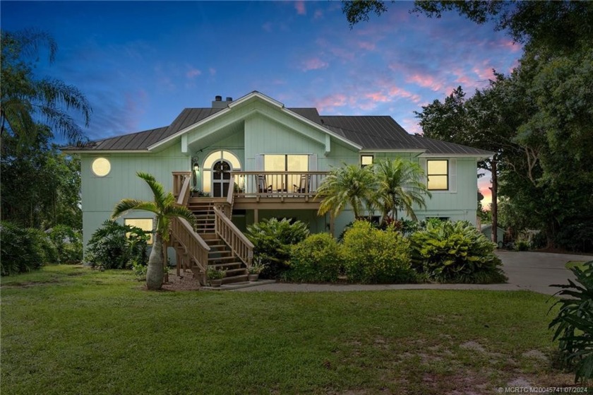 This updated Key West home on a 2.72-acre lakefront lot features - Beach Home for sale in Palm City, Florida on Beachhouse.com