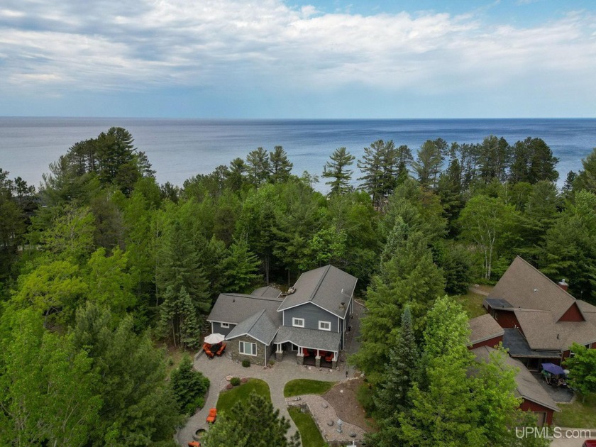 Nestled on the tranquil shores of Lake Superior lies a - Beach Home for sale in Marquette, Michigan on Beachhouse.com