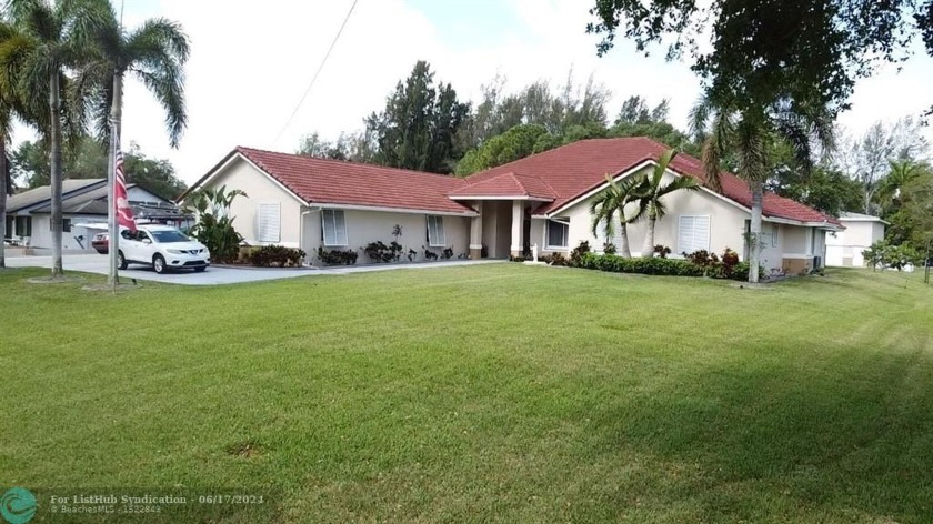 Enjoy living a tranquil family lifestyle in Sunshine Acres Where - Beach Home for sale in Davie, Florida on Beachhouse.com