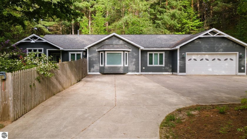Welcome home to this beautifully maintained 3 bedroom, 2.5 bath - Beach Home for sale in Williamsburg, Michigan on Beachhouse.com