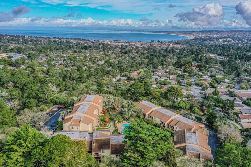 Ocean peeks, mountain views, and two private patios - this is - Beach Condo for sale in Monterey, California on Beachhouse.com