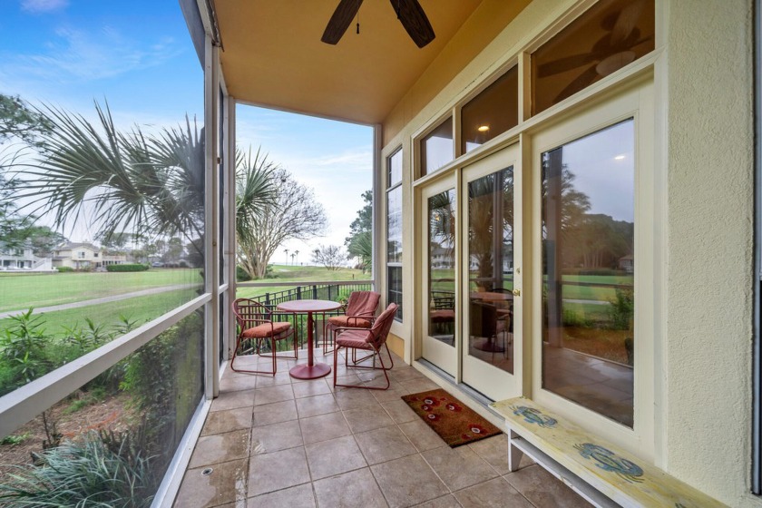 Bay and golf course views are abundant  from the porch and - Beach Home for sale in Miramar Beach, Florida on Beachhouse.com