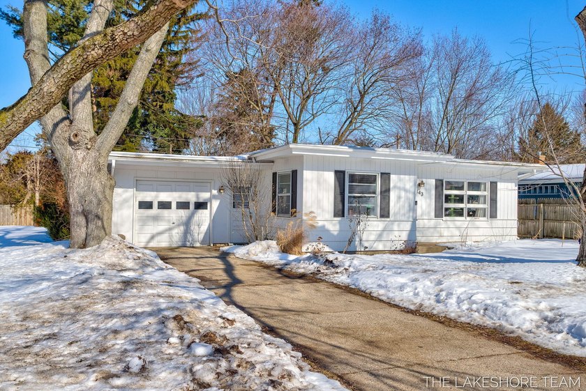This charming corner-lot home offers the perfect blend of - Beach Home for sale in Holland, Michigan on Beachhouse.com