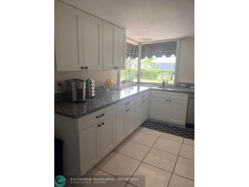 Discover this spacious 3-bedroom, 2.5-bathroom home situated on - Beach Home for sale in West Palm Beach, Florida on Beachhouse.com